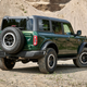 Ford Bronco four-door in green rear quarter view
